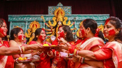 Crowds Gather For 'Sindoor Khela' At Bagbazar Sarbojanin On Bijoya Dashami
